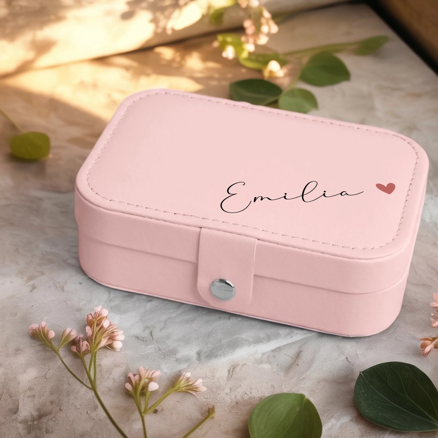 0001_2_a-jewelry-box-sits-on-a-neutral-stone-su_Ydk2BB8sQwiM8A0Y7cbmDg_EAF00DjQSb6ezGyMQnx5aA