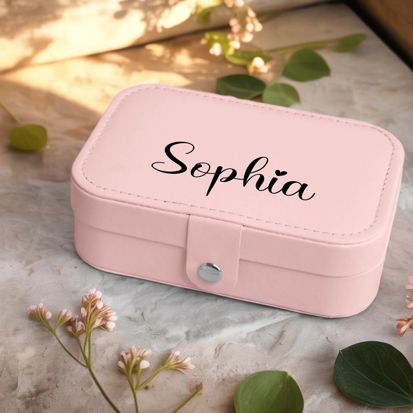 0001_2_a-jewelry-box-sits-on-a-neutral-stone-su_Ydk2BB8sQwiM8A0Y7cbmDg_EAF00DjQSb6ezGyMQnx5aA