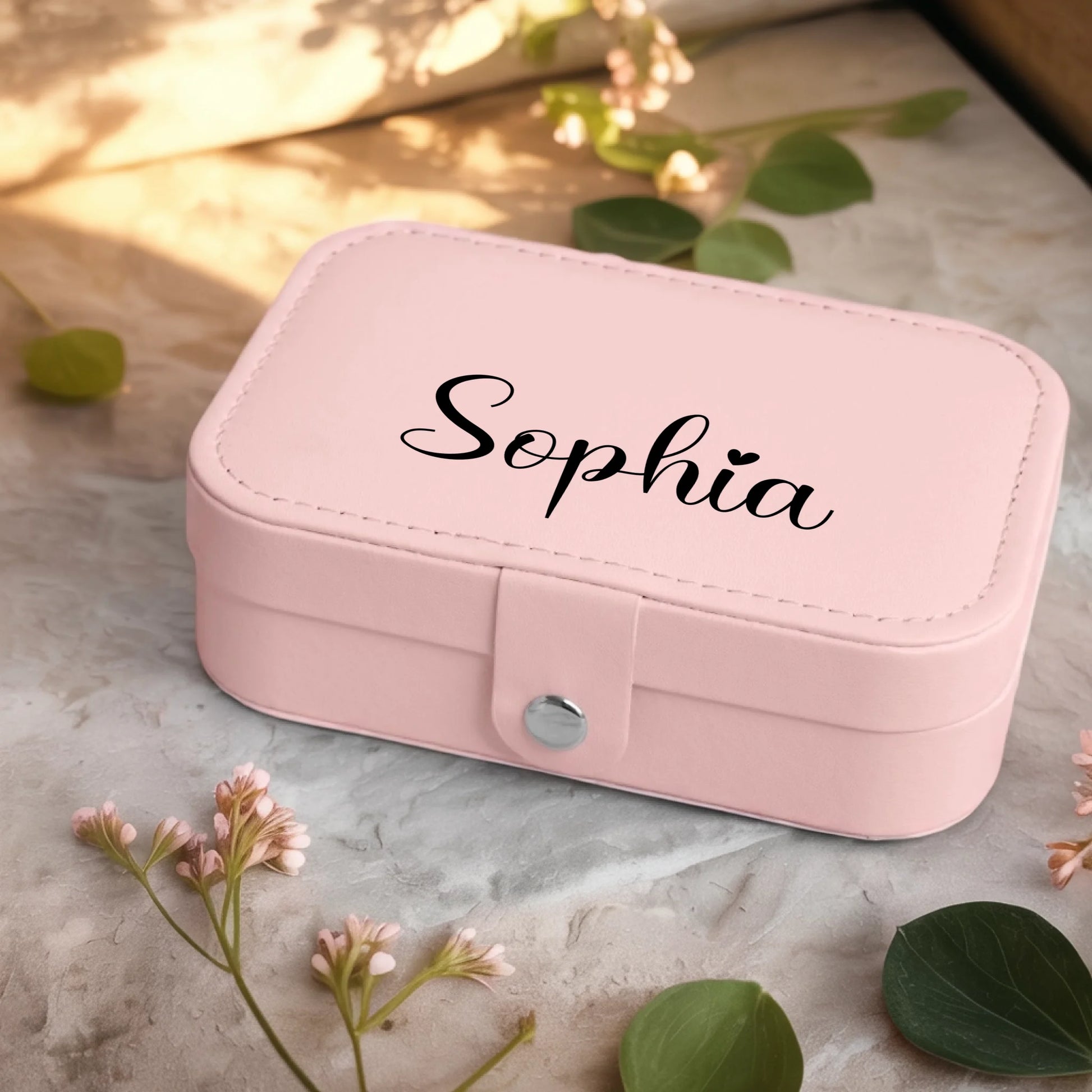 0001_2_a-jewelry-box-sits-on-a-neutral-stone-su_Ydk2BB8sQwiM8A0Y7cbmDg_EAF00DjQSb6ezGyMQnx5aA