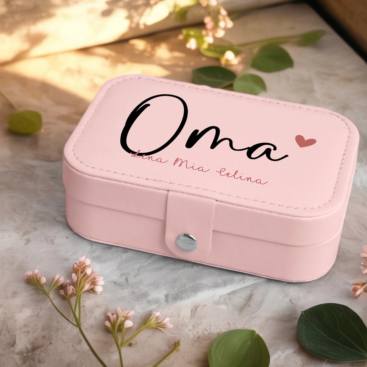 0001_2_a-jewelry-box-sits-on-a-neutral-stone-su_Ydk2BB8sQwiM8A0Y7cbmDg_EAF00DjQSb6ezGyMQnx5aA