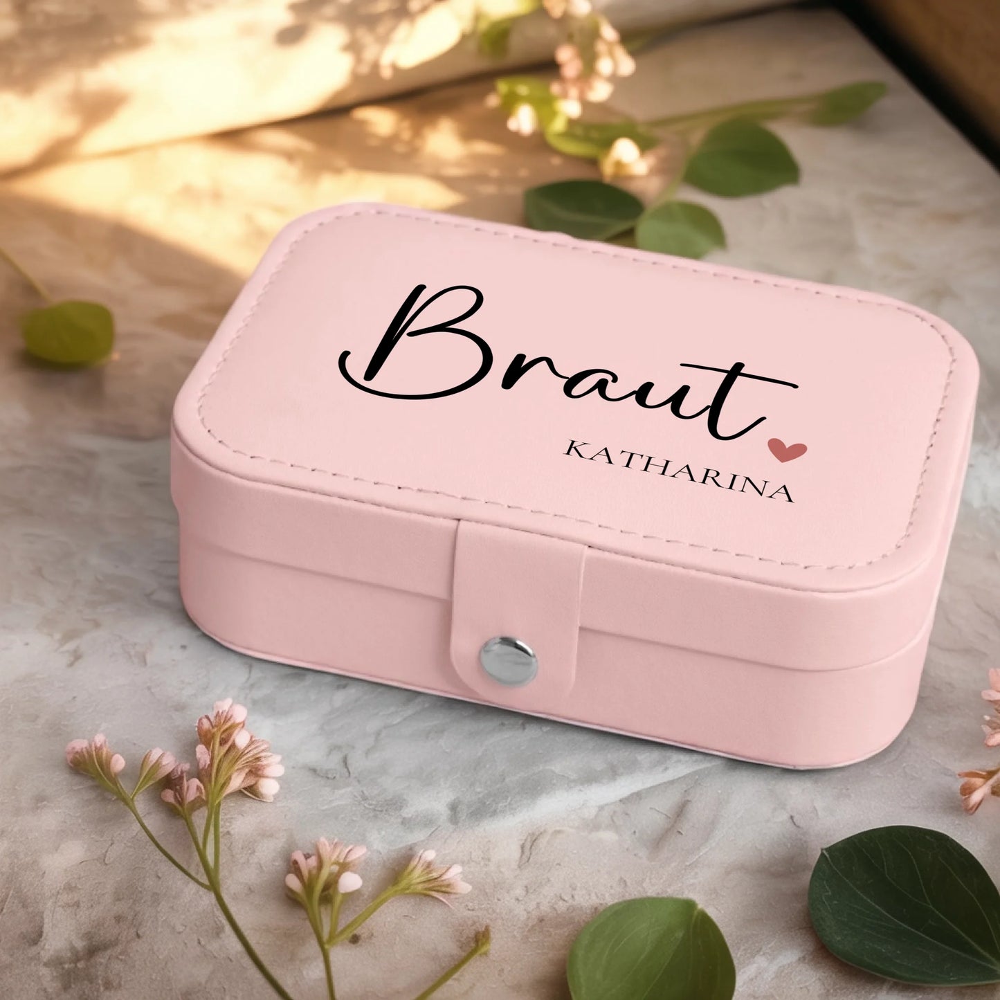 0001_2_a-jewelry-box-sits-on-a-neutral-stone-su_Ydk2BB8sQwiM8A0Y7cbmDg_EAF00DjQSb6ezGyMQnx5aA