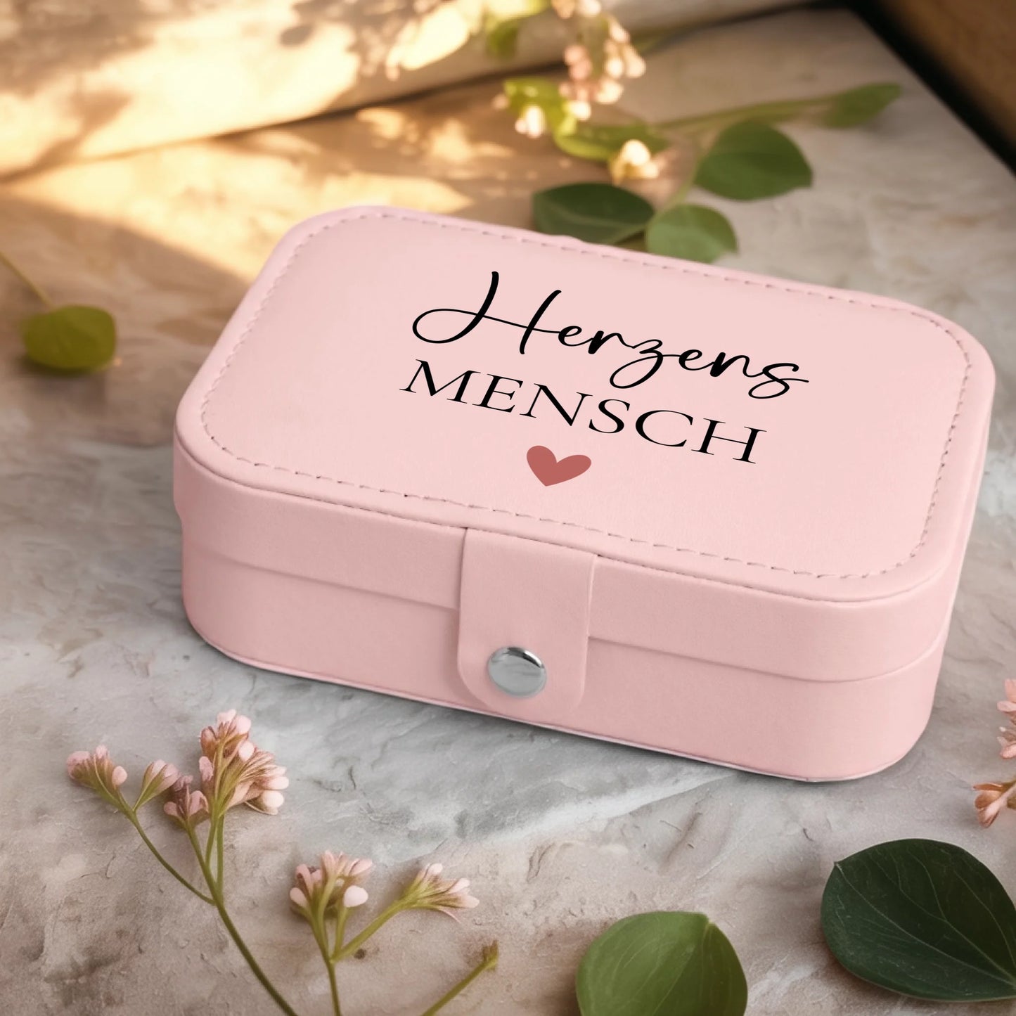 0001_2_a-jewelry-box-sits-on-a-neutral-stone-su_Ydk2BB8sQwiM8A0Y7cbmDg_EAF00DjQSb6ezGyMQnx5aA