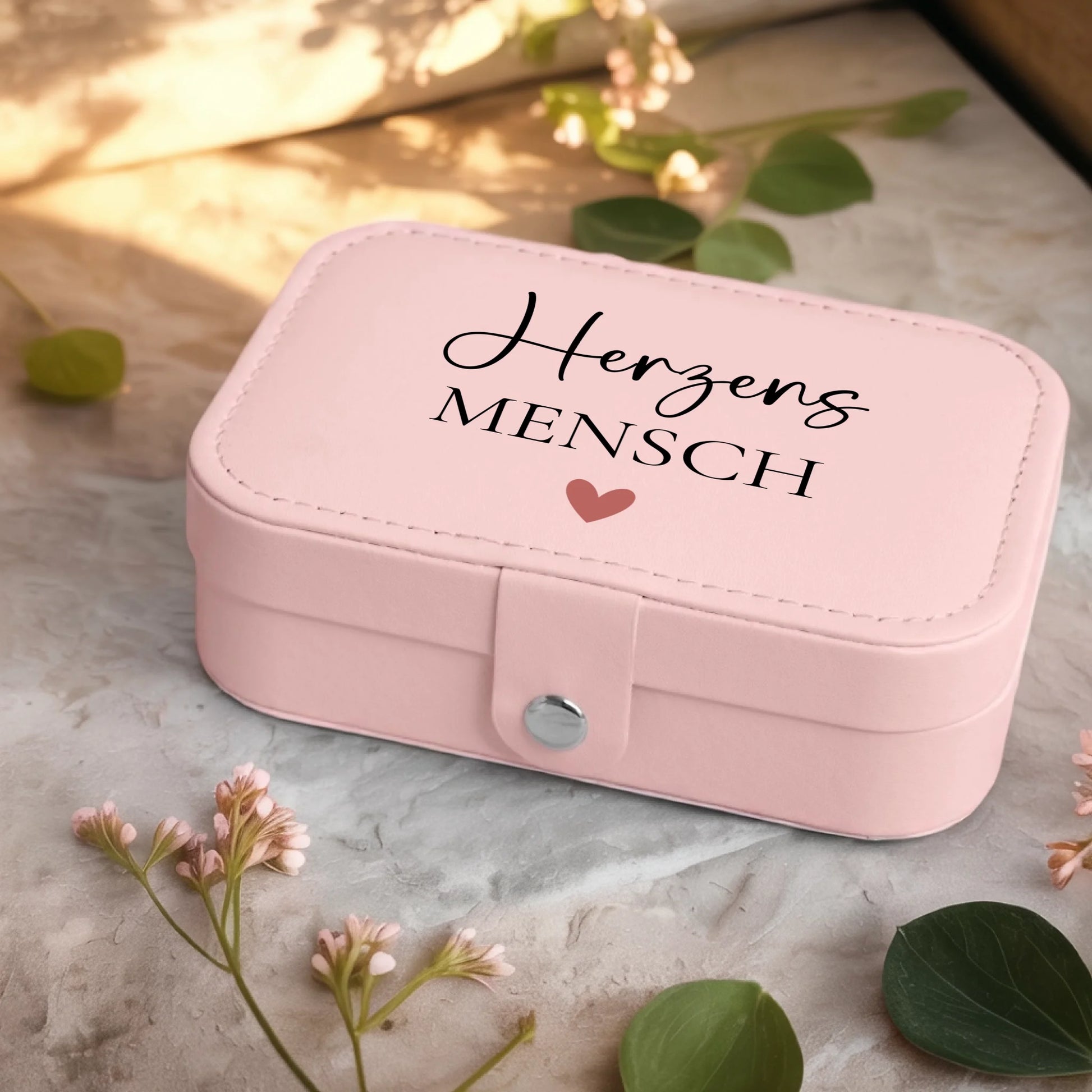 0001_2_a-jewelry-box-sits-on-a-neutral-stone-su_Ydk2BB8sQwiM8A0Y7cbmDg_EAF00DjQSb6ezGyMQnx5aA