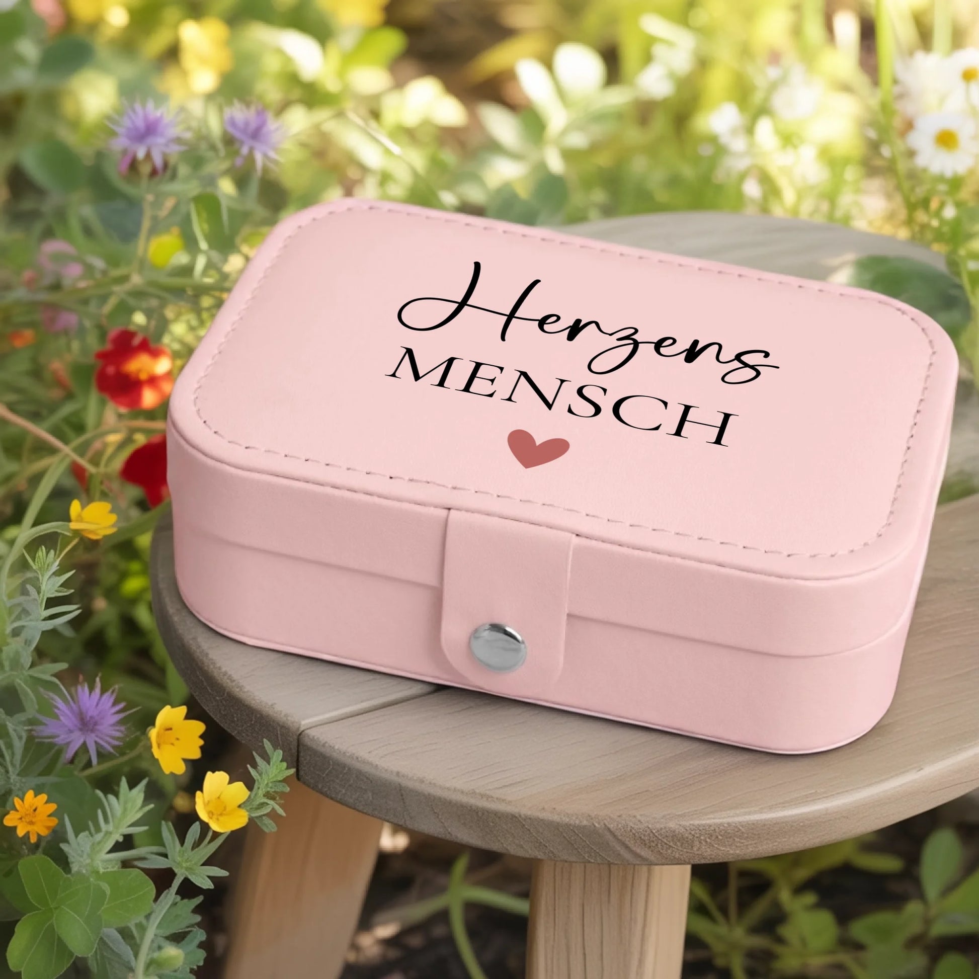 0002_1_a-jewelry-box-rests-on-a-wooden-table-in_jtTehCEgQoesk_XW48583Q_8bqHNi4kT0Oo3bStArII8A