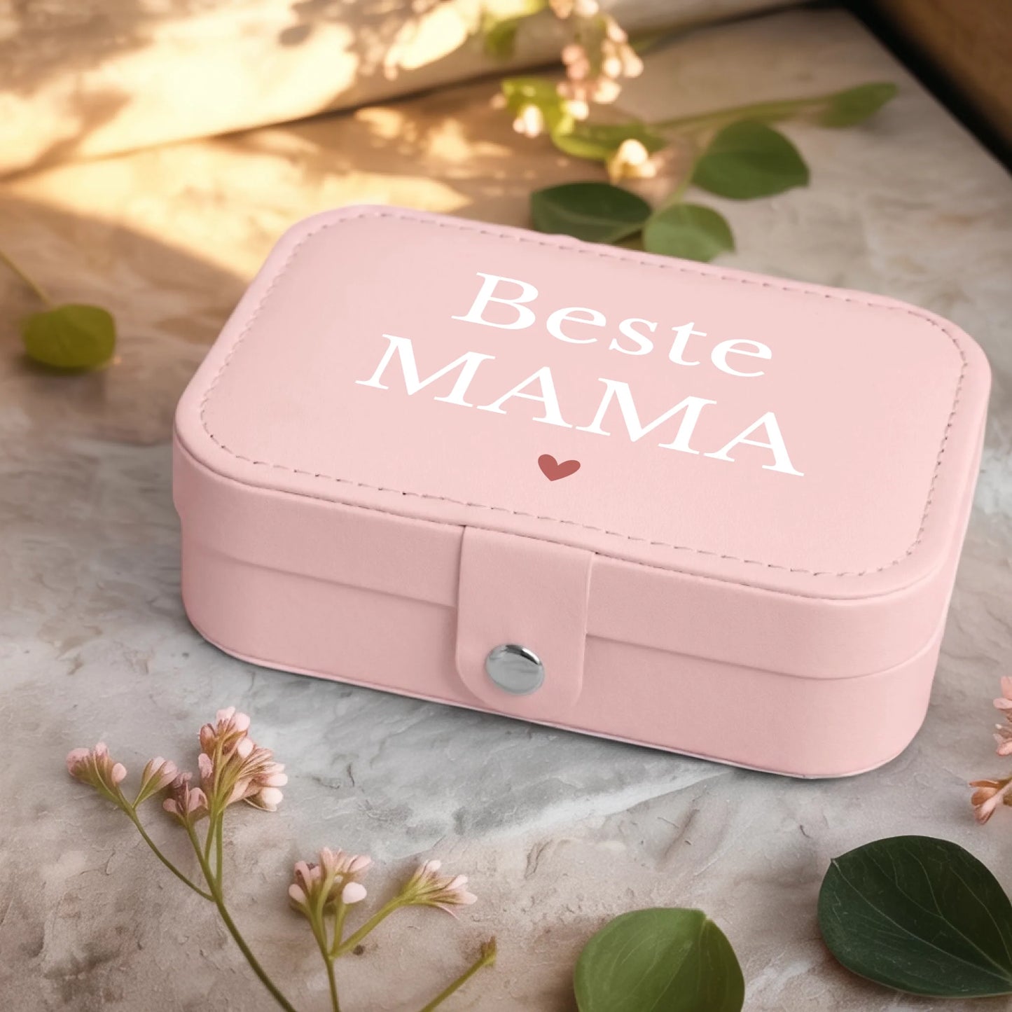 0001_2_a-jewelry-box-sits-on-a-neutral-stone-su_Ydk2BB8sQwiM8A0Y7cbmDg_EAF00DjQSb6ezGyMQnx5aA