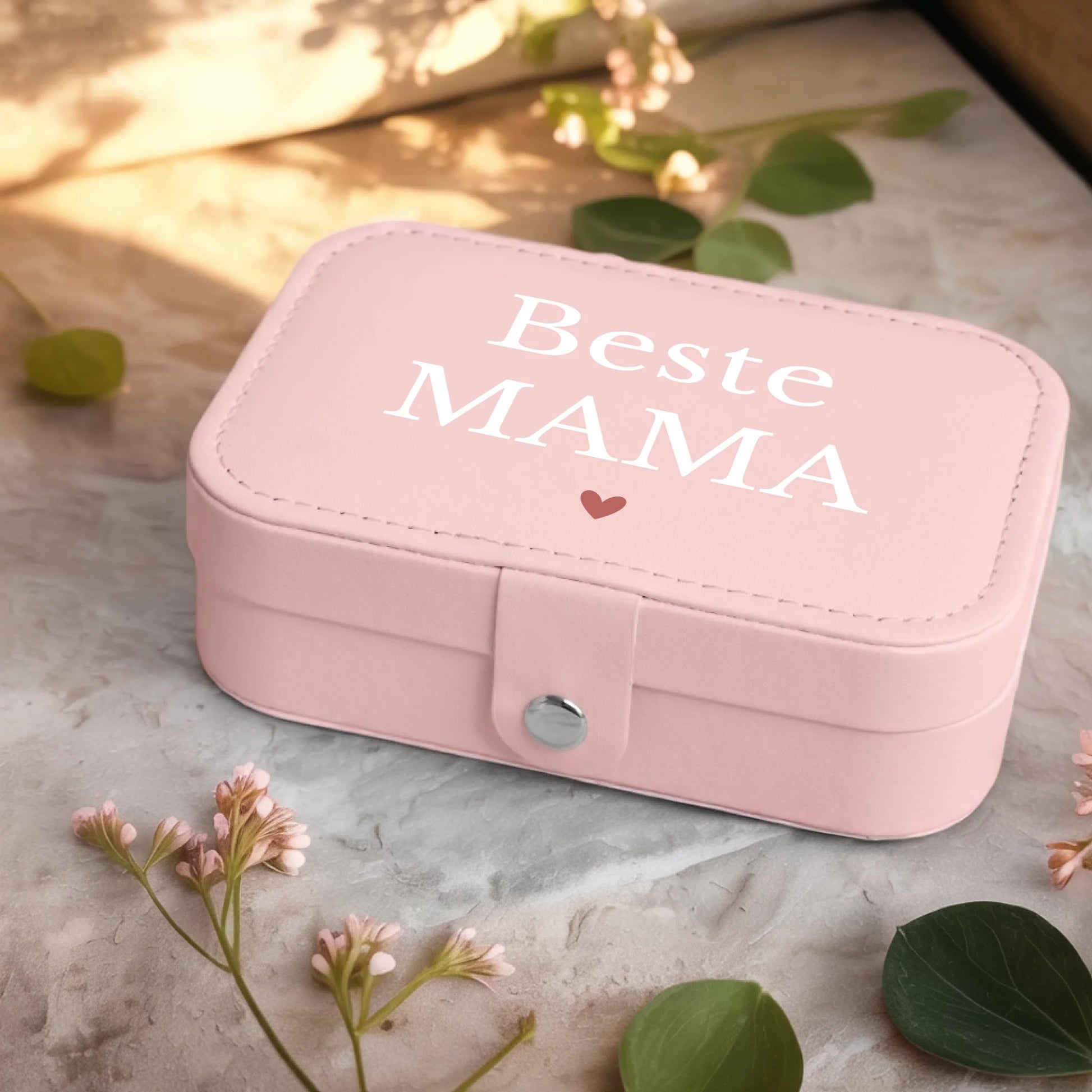 0001_2_a-jewelry-box-sits-on-a-neutral-stone-su_Ydk2BB8sQwiM8A0Y7cbmDg_EAF00DjQSb6ezGyMQnx5aA