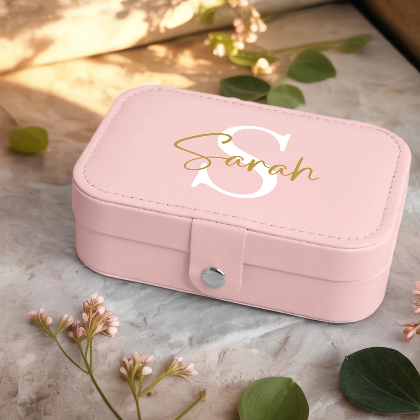 0001_2_a-jewelry-box-sits-on-a-neutral-stone-su_Ydk2BB8sQwiM8A0Y7cbmDg_EAF00DjQSb6ezGyMQnx5aA