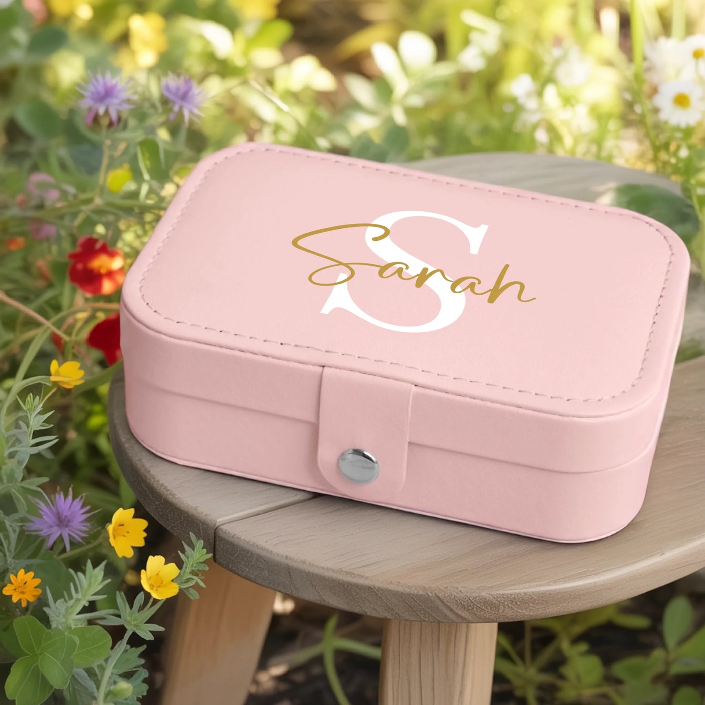 0002_1_a-jewelry-box-rests-on-a-wooden-table-in_jtTehCEgQoesk_XW48583Q_8bqHNi4kT0Oo3bStArII8A