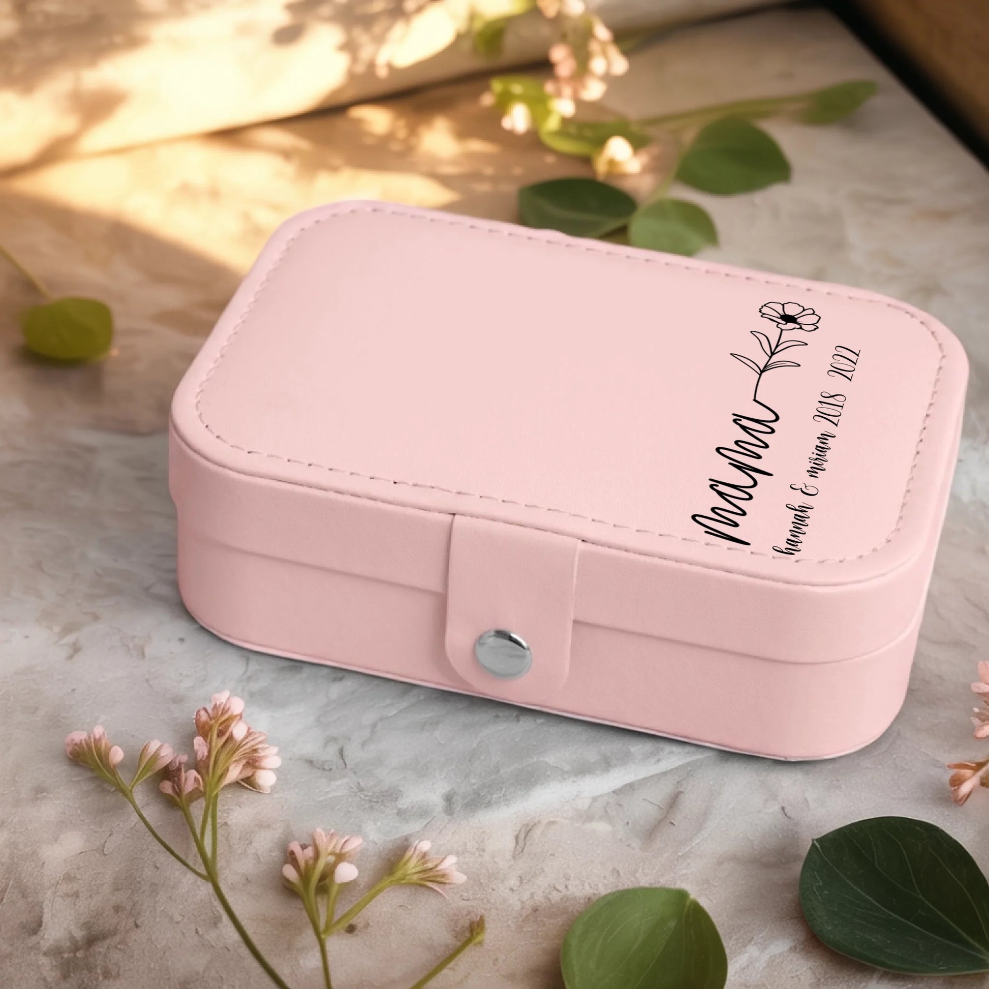 0001_2_a-jewelry-box-sits-on-a-neutral-stone-su_Ydk2BB8sQwiM8A0Y7cbmDg_EAF00DjQSb6ezGyMQnx5aA