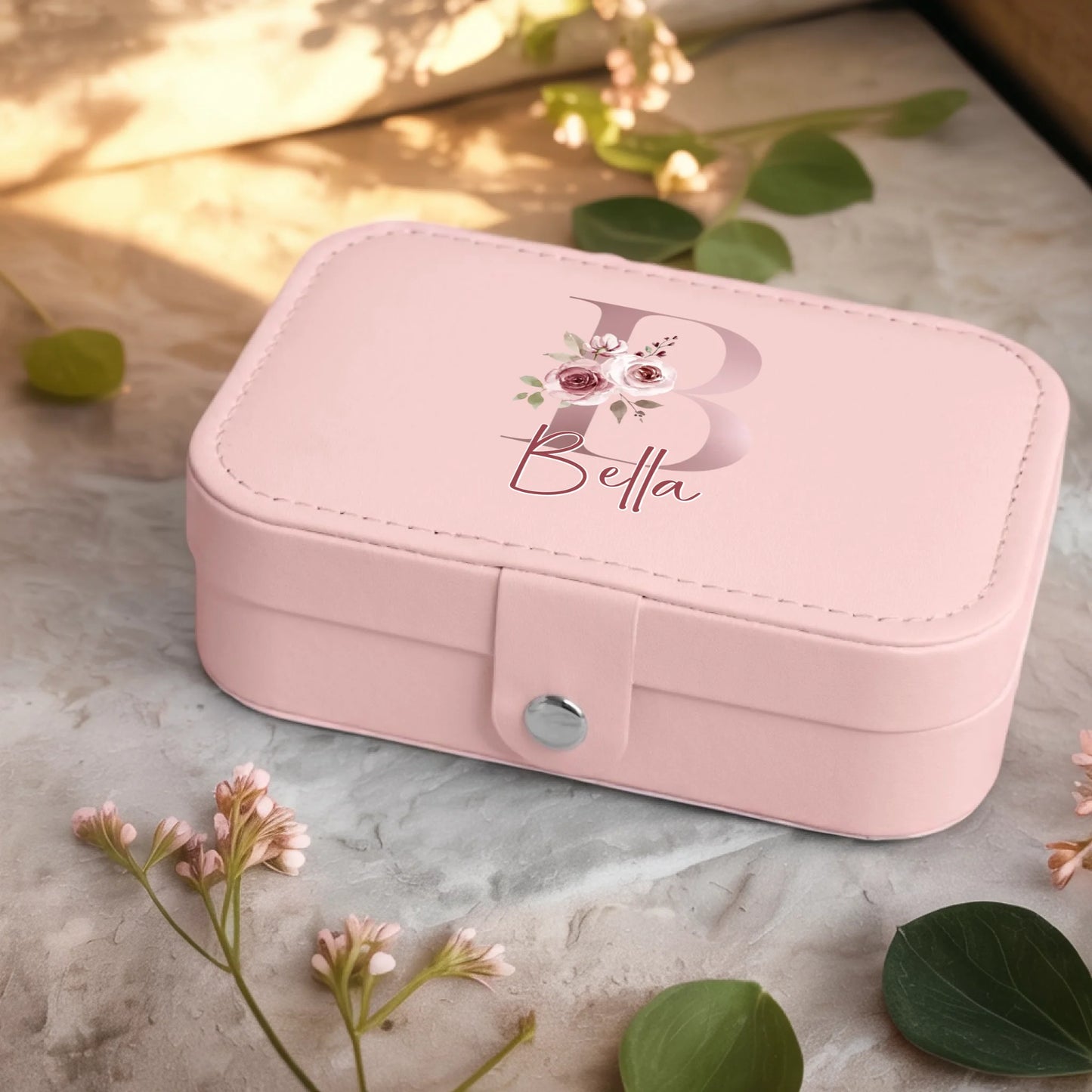 0001_2_a-jewelry-box-sits-on-a-neutral-stone-su_Ydk2BB8sQwiM8A0Y7cbmDg_EAF00DjQSb6ezGyMQnx5aA