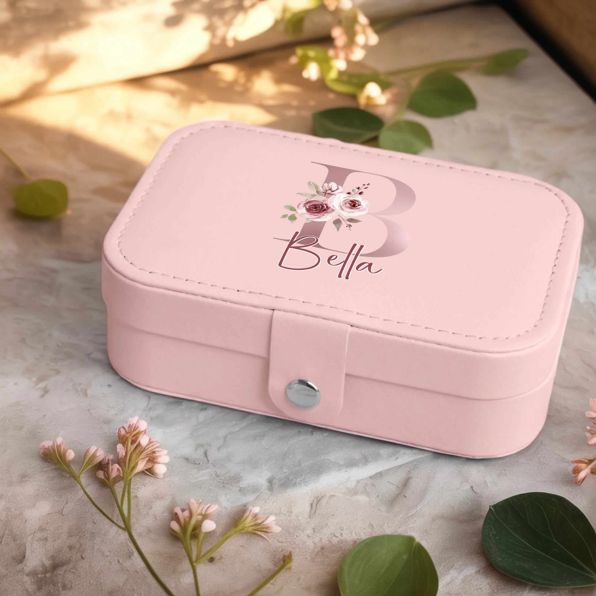 0001_2_a-jewelry-box-sits-on-a-neutral-stone-su_Ydk2BB8sQwiM8A0Y7cbmDg_EAF00DjQSb6ezGyMQnx5aA