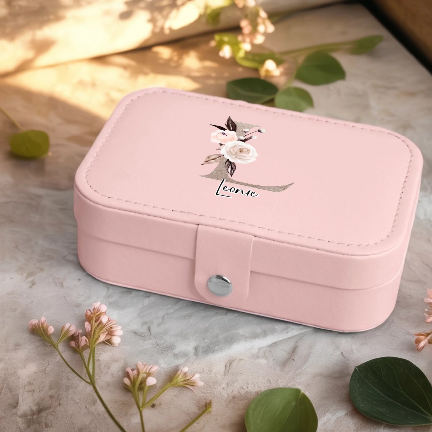 0001_2_a-jewelry-box-sits-on-a-neutral-stone-su_Ydk2BB8sQwiM8A0Y7cbmDg_EAF00DjQSb6ezGyMQnx5aA