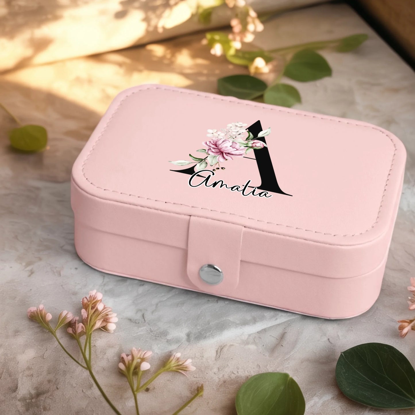 0001_2_a-jewelry-box-sits-on-a-neutral-stone-su_Ydk2BB8sQwiM8A0Y7cbmDg_EAF00DjQSb6ezGyMQnx5aA