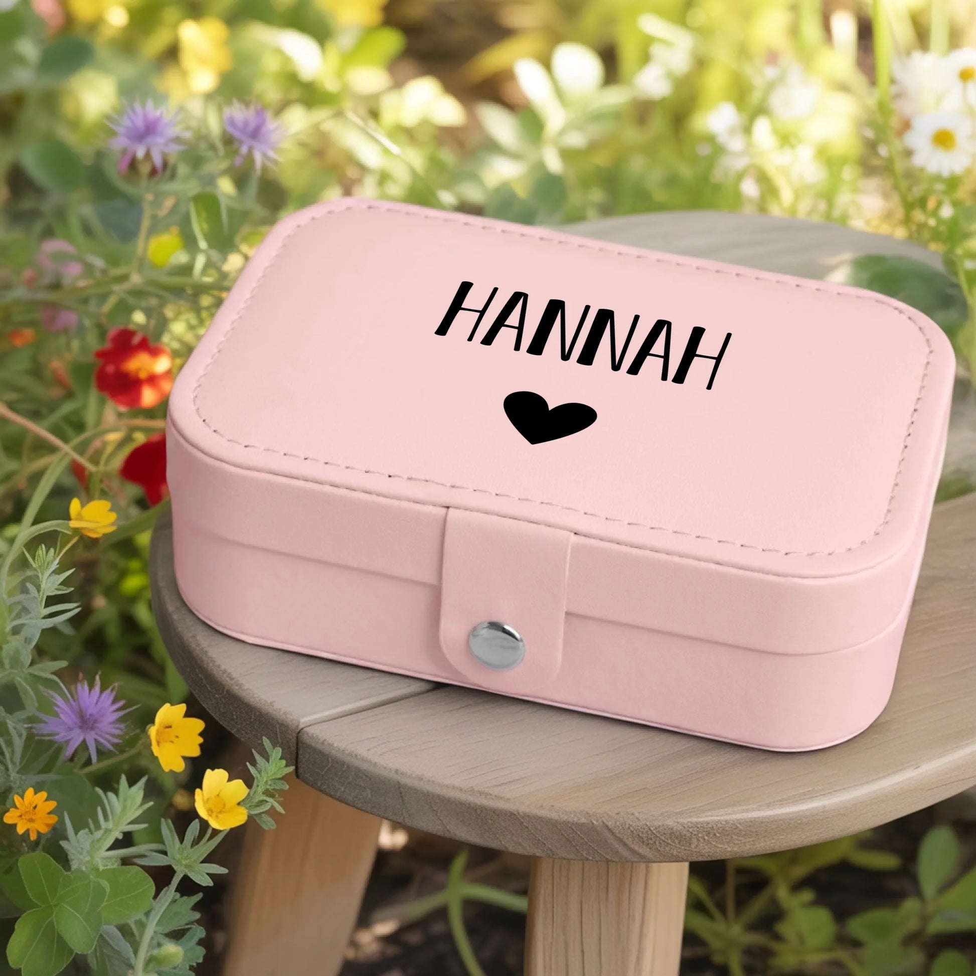 0002_1_a-jewelry-box-rests-on-a-wooden-table-in_jtTehCEgQoesk_XW48583Q_8bqHNi4kT0Oo3bStArII8A