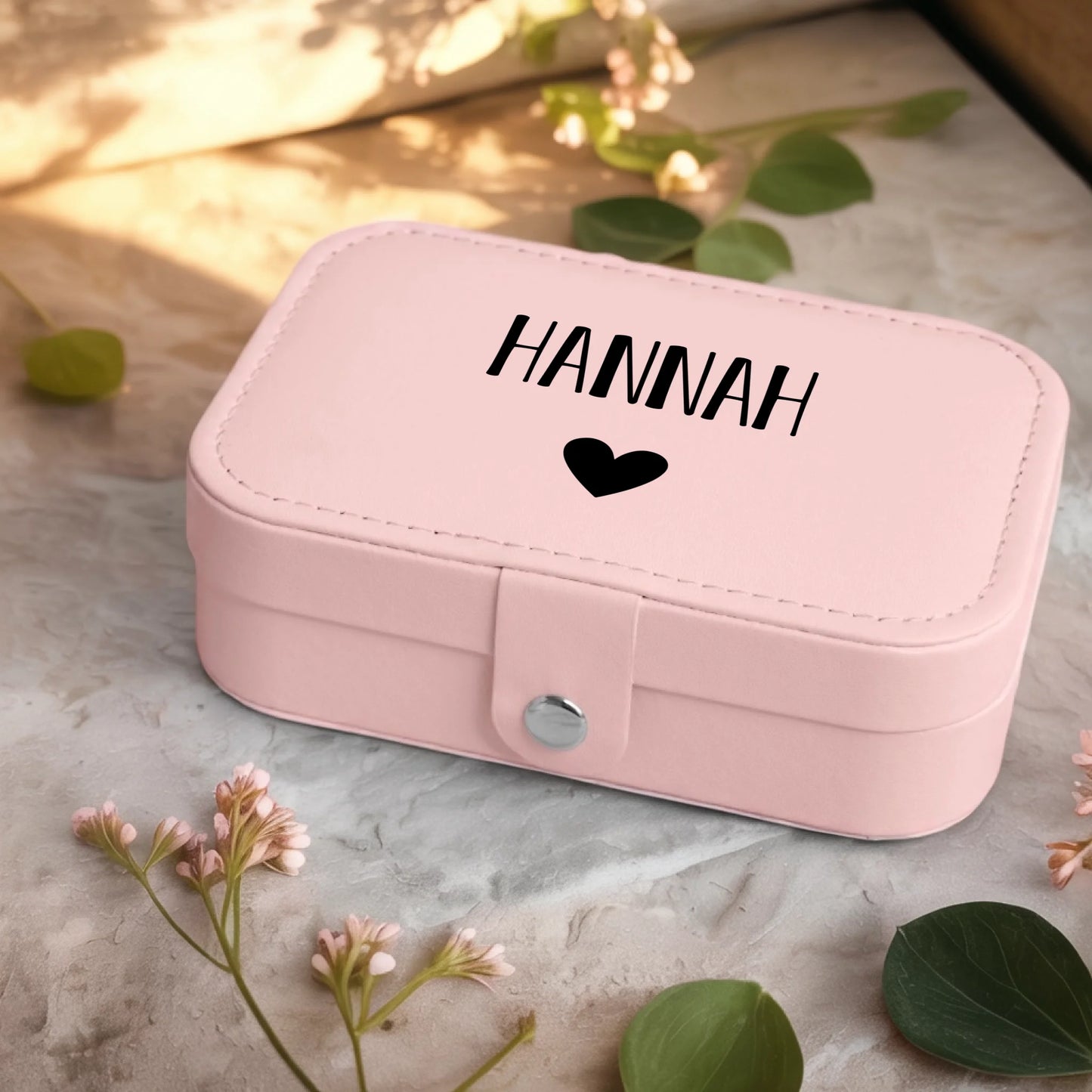 0001_2_a-jewelry-box-sits-on-a-neutral-stone-su_Ydk2BB8sQwiM8A0Y7cbmDg_EAF00DjQSb6ezGyMQnx5aA