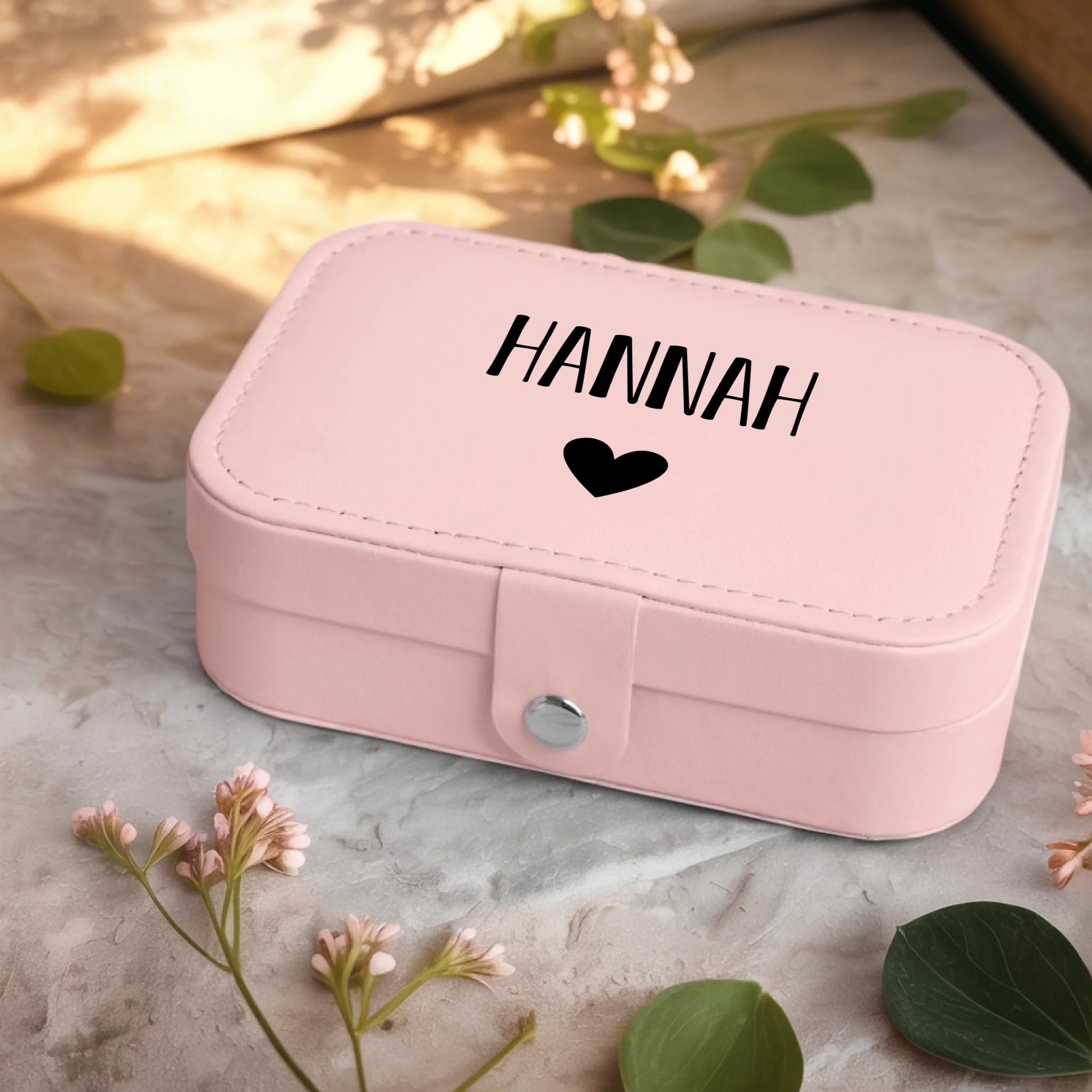 0001_2_a-jewelry-box-sits-on-a-neutral-stone-su_Ydk2BB8sQwiM8A0Y7cbmDg_EAF00DjQSb6ezGyMQnx5aA