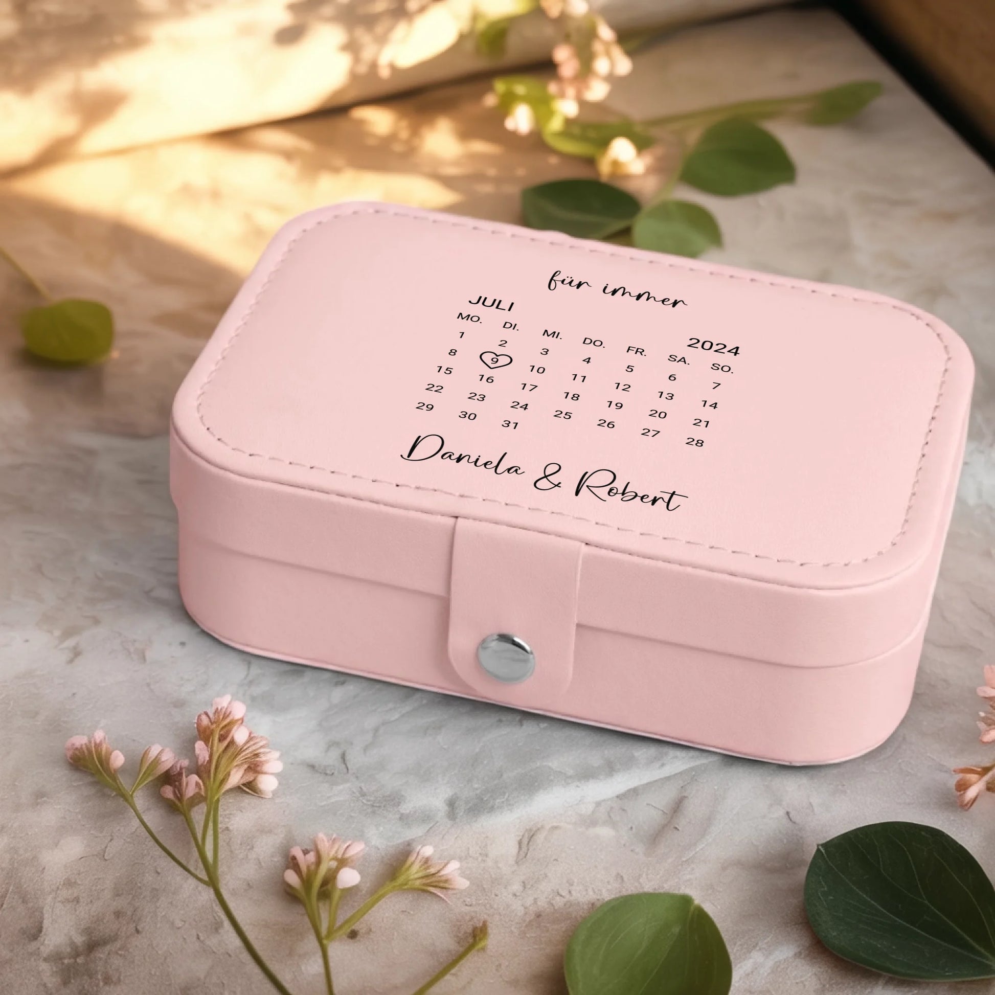 0001_2_a-jewelry-box-sits-on-a-neutral-stone-su_Ydk2BB8sQwiM8A0Y7cbmDg_EAF00DjQSb6ezGyMQnx5aA